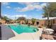 Private backyard pool with a sun deck and beautiful landscaping at 16876 W Stevenage St, Surprise, AZ 85374