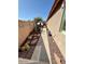 Narrow side yard showcasing low-maintenance landscaping, perfect for easy upkeep at 16876 W Stevenage St, Surprise, AZ 85374