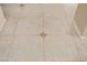Close up view of neutral tile floor with inset design at 16876 W Stevenage St, Surprise, AZ 85374