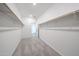 This walk-in closet provides ample storage with shelves and rods for organization at 18007 W Camino De Oro --, Surprise, AZ 85387