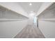 Bright walk-in closet with rod and shelf storage, connecting to the bedroom at 18007 W Camino De Oro --, Surprise, AZ 85387