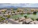 Beautiful homes line a tranquil lake, creating a serene and picturesque community setting at 1806 N 108Th Ave, Avondale, AZ 85392
