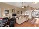 Spacious living room with hardwood floors, high ceilings, and ample seating at 1806 N 108Th Ave, Avondale, AZ 85392