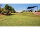 Community park featuring a lush green lawn and a fun playground, perfect for outdoor activities at 1806 N 108Th Ave, Avondale, AZ 85392