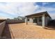 Spacious backyard with covered patio and privacy fence at 18171 W Daley Ln, Surprise, AZ 85387