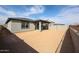 Spacious backyard features a covered patio, perfect for outdoor entertaining at 18171 W Daley Ln, Surprise, AZ 85387
