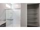 Bathroom includes large shower and walk-in closet for extra storage at 18171 W Daley Ln, Surprise, AZ 85387
