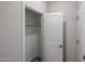 Bedroom closet with open door and clothes hanging rod at 18171 W Daley Ln, Surprise, AZ 85387