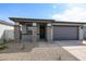 A single story home showcasing stone pillar accents and desert landscaping at 18171 W Daley Ln, Surprise, AZ 85387