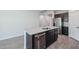 Kitchen featuring granite countertops, stainless steel dishwasher and sink at 18171 W Daley Ln, Surprise, AZ 85387