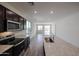 Modern kitchen with stainless steel appliances, granite countertops and a large island at 18171 W Daley Ln, Surprise, AZ 85387