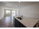 Spacious living room with modern tiled floors and recessed lighting at 18171 W Daley Ln, Surprise, AZ 85387