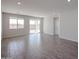 Open living area featuring tiled floors, recessed lighting and sliding glass doors to the backyard at 18171 W Daley Ln, Surprise, AZ 85387