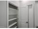 Pantry features ample shelving space and a white interior at 18171 W Daley Ln, Surprise, AZ 85387