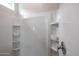 Modern shower with built in shelving and sleek design at 18171 W Daley Ln, Surprise, AZ 85387