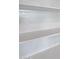 Close up view of a modern white window treatment showing horizontal lines at 18171 W Daley Ln, Surprise, AZ 85387