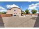 Large backyard with desert landscaping, block fence, and views of the home at 18601 N 16Th Pl, Phoenix, AZ 85024