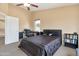 Spacious bedroom featuring a well-lit desk and bookcase with an open doorway at 18601 N 16Th Pl, Phoenix, AZ 85024
