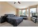 Spacious bedroom with vaulted ceiling, large windows, and bonus lounge area at 18601 N 16Th Pl, Phoenix, AZ 85024