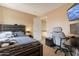 Comfortable bedroom features desk space, television, and neutral decor at 18601 N 16Th Pl, Phoenix, AZ 85024