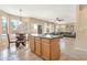 Bright kitchen with a breakfast bar, dining area, and an open floor plan at 18601 N 16Th Pl, Phoenix, AZ 85024