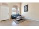 Inviting living room showcasing tile floors, large windows, and comfortable seating at 18601 N 16Th Pl, Phoenix, AZ 85024