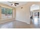 Open living area with tile floors, neutral walls, and access to the backyard at 18601 N 16Th Pl, Phoenix, AZ 85024