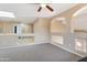 Cozy loft area featuring carpeting, neutral colored walls, arched hallways, and a skylight for natural light at 18601 N 16Th Pl, Phoenix, AZ 85024