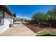 Spacious backyard with lush landscaping, features a covered patio and a sparkling pool at 18829 N 23Rd Ave, Phoenix, AZ 85027