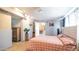 View of bed and closet access with dresser, and cozy lighting at 18829 N 23Rd Ave, Phoenix, AZ 85027