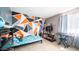 Playful bedroom with geometric wall art, a twin bed, and a variety of toys and stuffed animals at 18829 N 23Rd Ave, Phoenix, AZ 85027