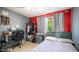 Bedroom with a grey bed, work desk, and good natural light, with modern decor at 18829 N 23Rd Ave, Phoenix, AZ 85027