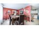 Dining room with wood table and brown upholstered chairs, showcasing colorful wall decor at 18829 N 23Rd Ave, Phoenix, AZ 85027