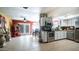 Bright, open kitchen with white cabinets, stainless steel appliances, and tile flooring at 18829 N 23Rd Ave, Phoenix, AZ 85027