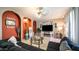Inviting living room with neutral walls, arched doorways, and a cozy fireplace feature at 18829 N 23Rd Ave, Phoenix, AZ 85027
