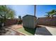 Backyard shed with new turf, a play structure, string lights, and block wall at 18829 N 23Rd Ave, Phoenix, AZ 85027