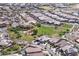Beautiful aerial view of a community with greenbelts and playgrounds located in a peaceful desert environment at 24127 N 166Th Ct, Surprise, AZ 85387