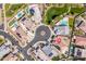 Aerial view of a desert home with a red pin drop, circle drive, solar panels, pool, and landscaping at 24127 N 166Th Ct, Surprise, AZ 85387