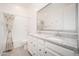 Clean, bright bathroom featuring double sinks, a shower, and tile floors at 24127 N 166Th Ct, Surprise, AZ 85387