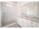 Bathroom featuring a walk-in shower, granite countertops, white cabinets, and modern fixtures at 24127 N 166Th Ct, Surprise, AZ 85387