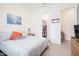 Bright bedroom features a walk-in closet and neutral tones at 24127 N 166Th Ct, Surprise, AZ 85387
