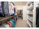 Spacious walk-in closet with shelves and hanging racks to maximize organization and storage at 24127 N 166Th Ct, Surprise, AZ 85387