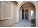 Inviting entryway featuring a security door, decorative window, and a neutral color palette at 24127 N 166Th Ct, Surprise, AZ 85387