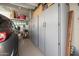 Garage featuring storage cabinets and epoxied floors at 24127 N 166Th Ct, Surprise, AZ 85387