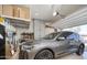 Garage featuring a work bench area and storage cabinets at 24127 N 166Th Ct, Surprise, AZ 85387