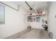 Spacious garage with hanging storage racks and natural light at 24127 N 166Th Ct, Surprise, AZ 85387