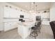Modern kitchen featuring white cabinets, a granite countertop island, stainless steel appliances and pendant lights at 24127 N 166Th Ct, Surprise, AZ 85387