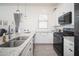Well-equipped kitchen featuring granite countertops, stainless steel appliances, and ample lighting at 24127 N 166Th Ct, Surprise, AZ 85387
