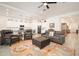 Open-concept living room featuring neutral walls, modern flooring and access to the kitchen at 24127 N 166Th Ct, Surprise, AZ 85387