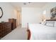 Spacious bedroom showcases a plush bed and ample closet space, perfect for relaxation at 24127 N 166Th Ct, Surprise, AZ 85387